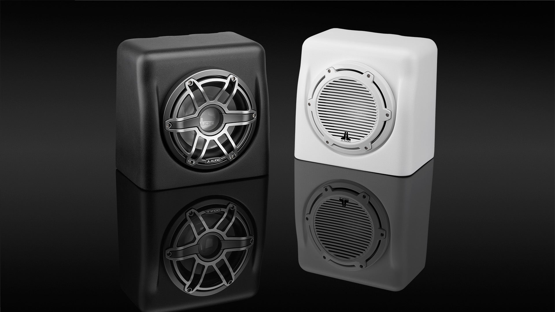 Pair of enclosed subwoofers in white and black finish.