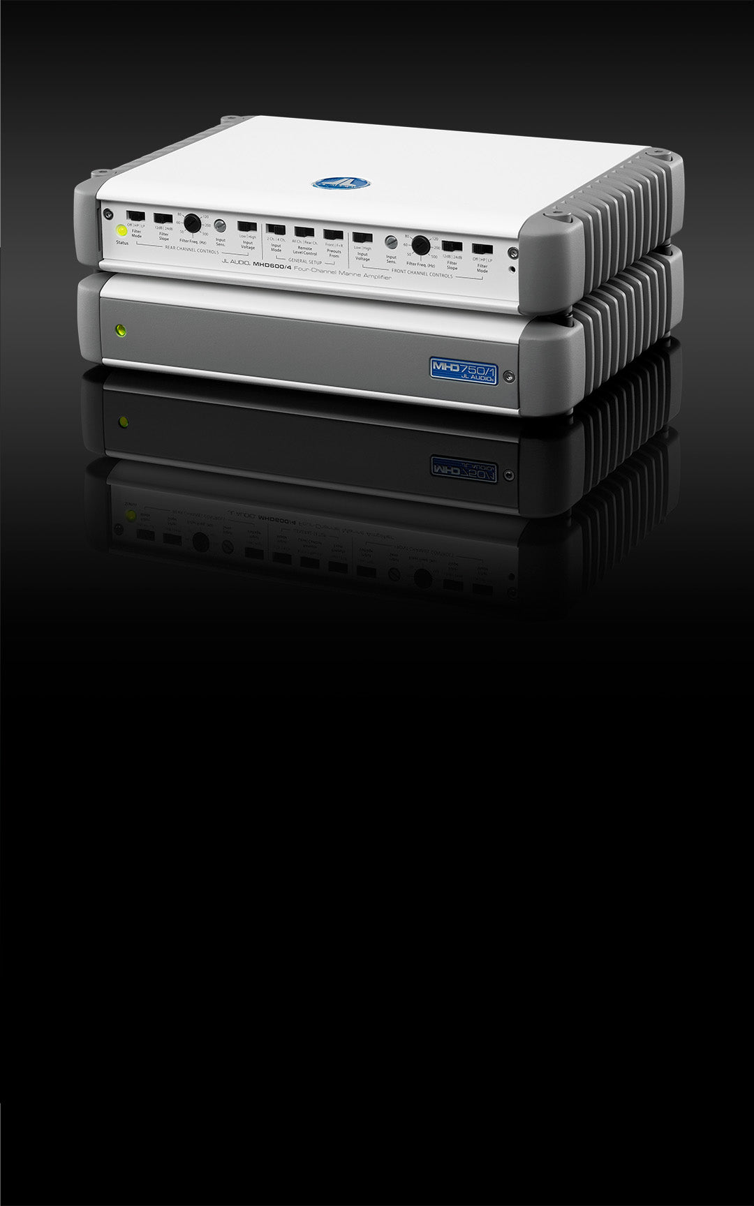 A pair of MHD amplifier stacked in a dark sleek setting and with the cover on.