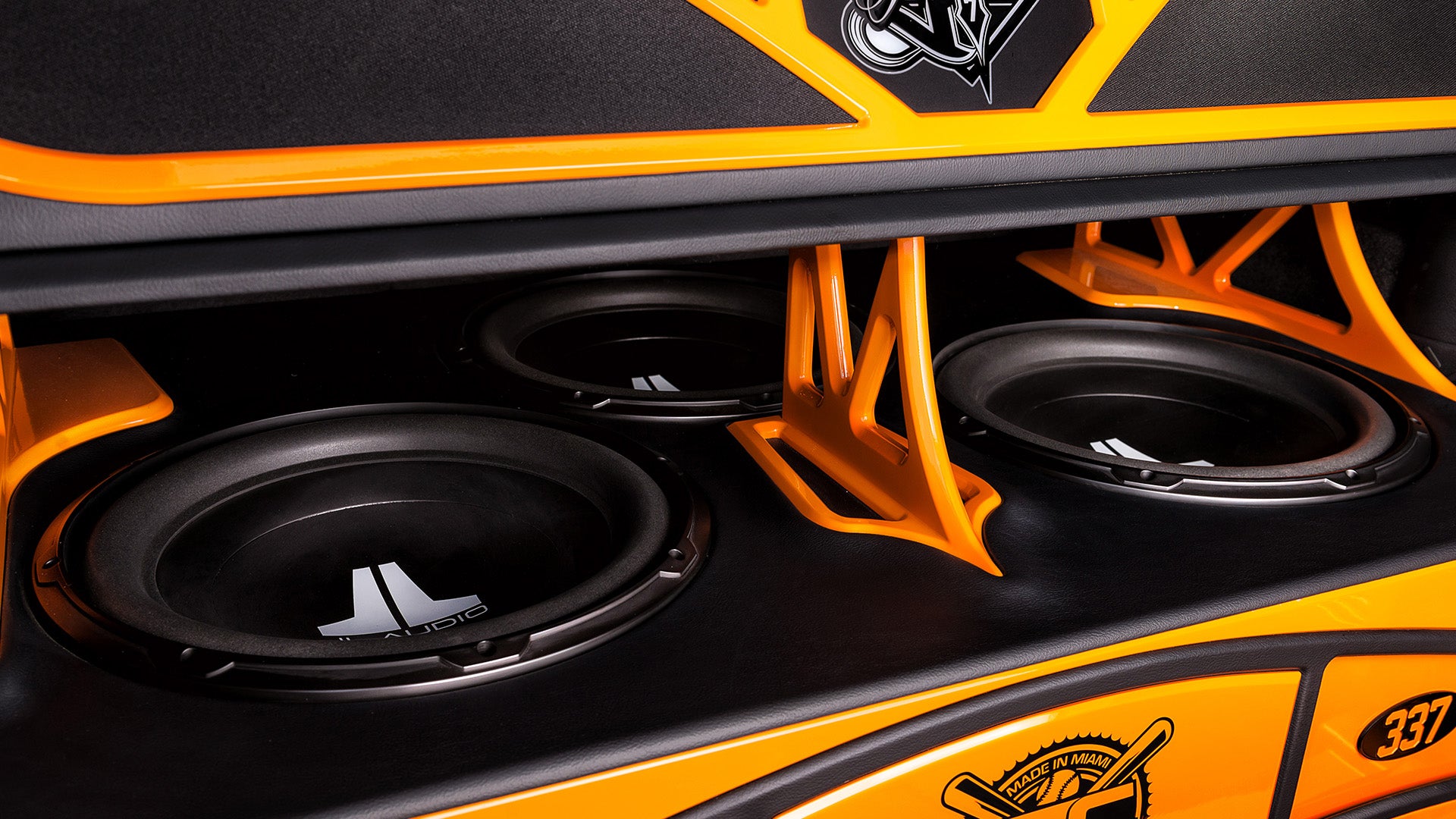 A Jeep vehicle with 3 W0v3 subwoofers.
