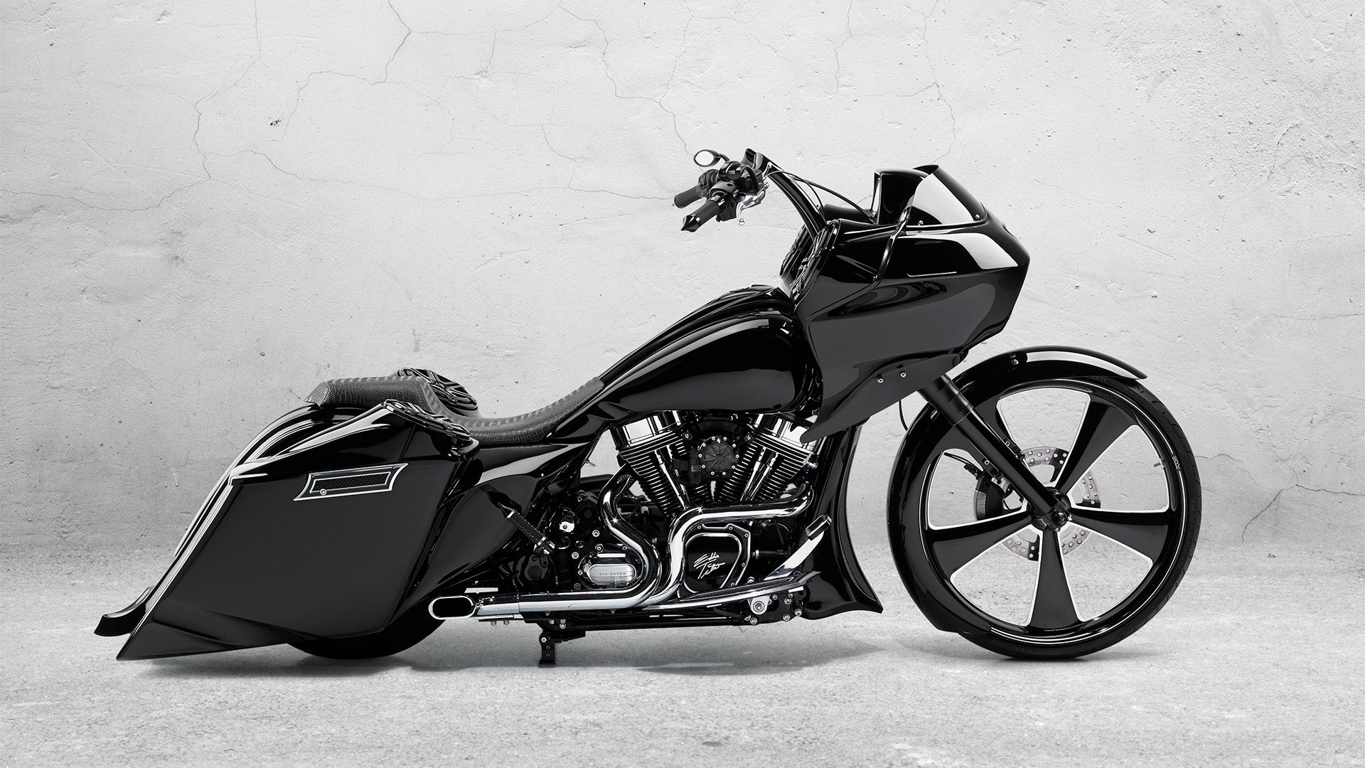 A black motorcycle side profile view.
