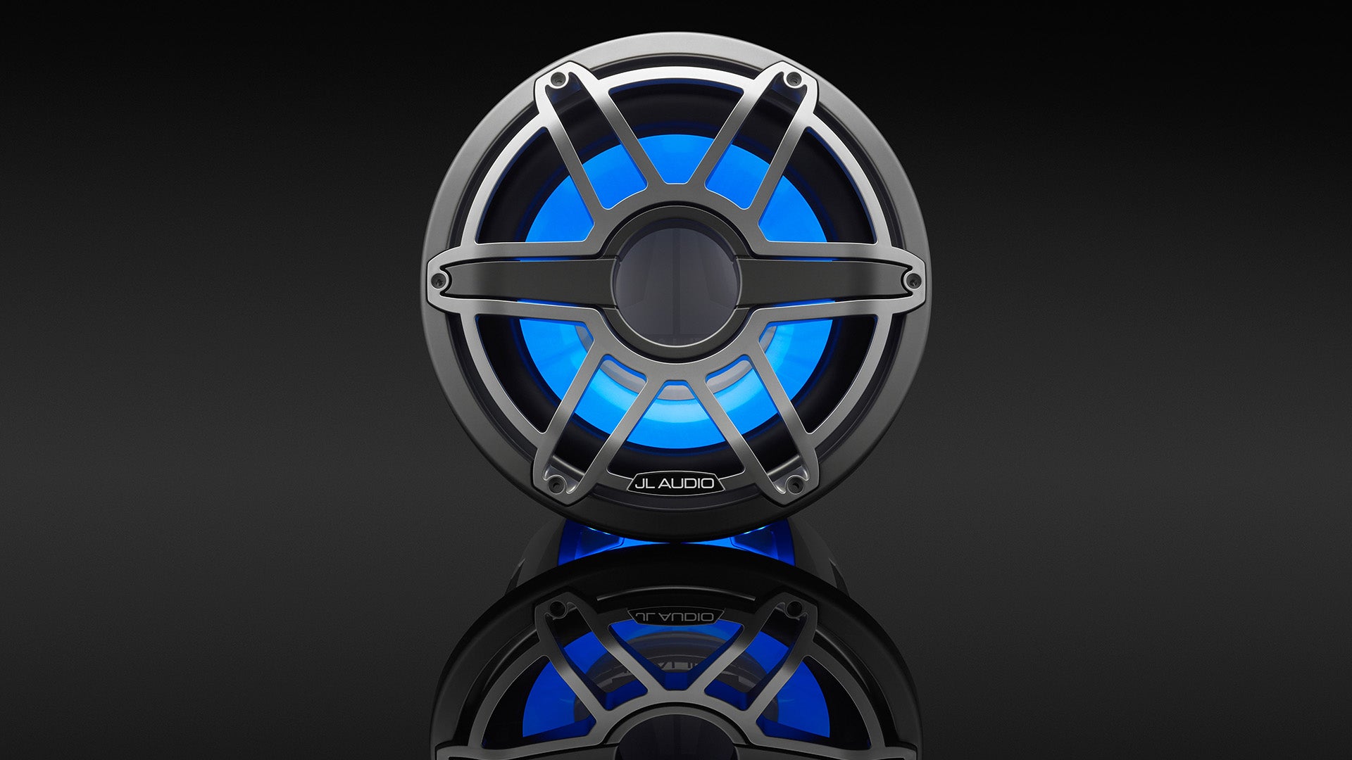 A gunmetal M7 subwoofer 12 inch with blue Transflective RGB Technology.