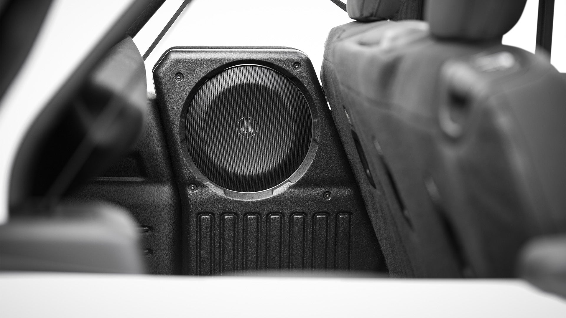 A TW1 subwoofer installed in a vehicle.