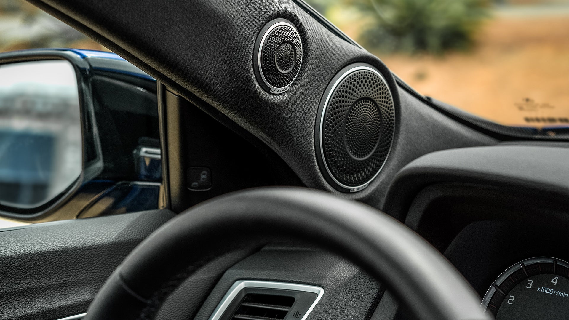 A pair of C7 car audio speakers in an Acura TLX.
