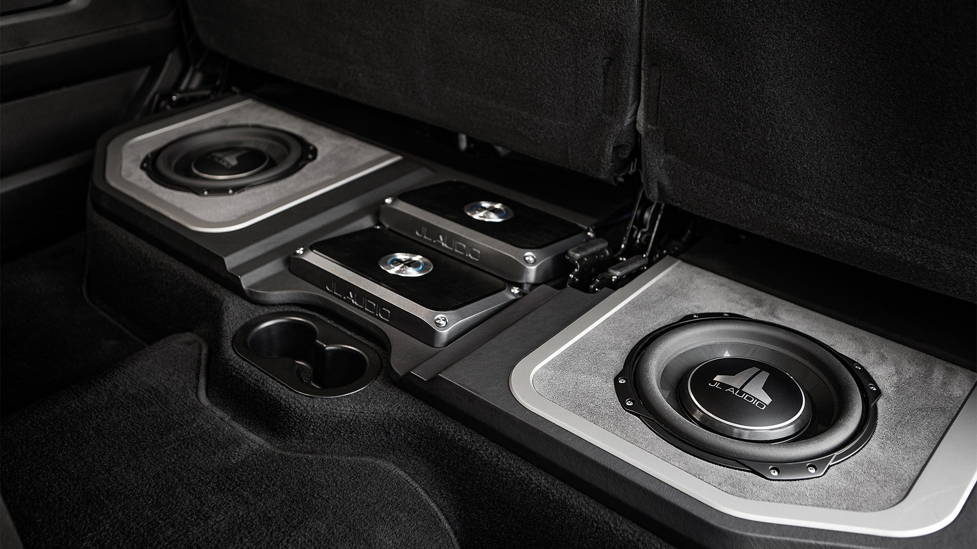 A pair of TW3 car audio subwoofers in a Ram truck.